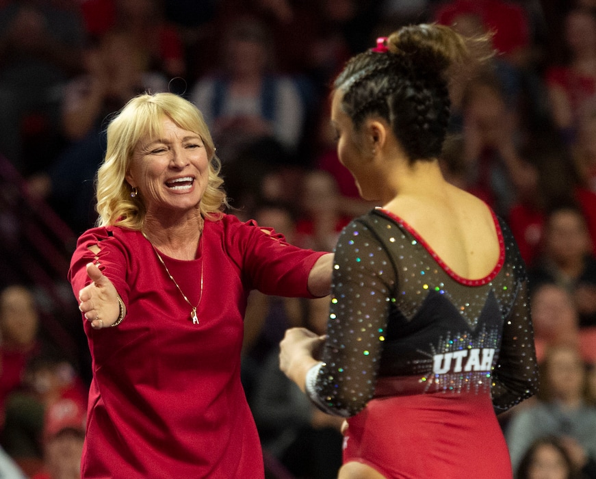 (Rick Egan  |  The Salt Lake Tribune)    Coach Megan Marsden congratulates Kari Lee after her performance on the beam for Utah, in the PAC-12 Gymnastics Championships at the Maverik Center, Saturday, March 23, 2019.
