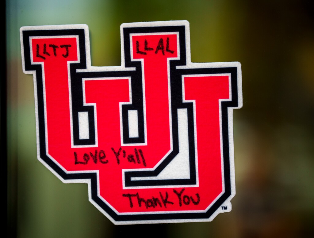 (Trent Nelson  |  The Salt Lake Tribune) Flowers, balloons, and messages memorialize Utah Utes cornerback Aaron Lowe (22) at the Spence and Cleone Eccles Football Center in Salt Lake City on Monday, Sept. 27, 2021.