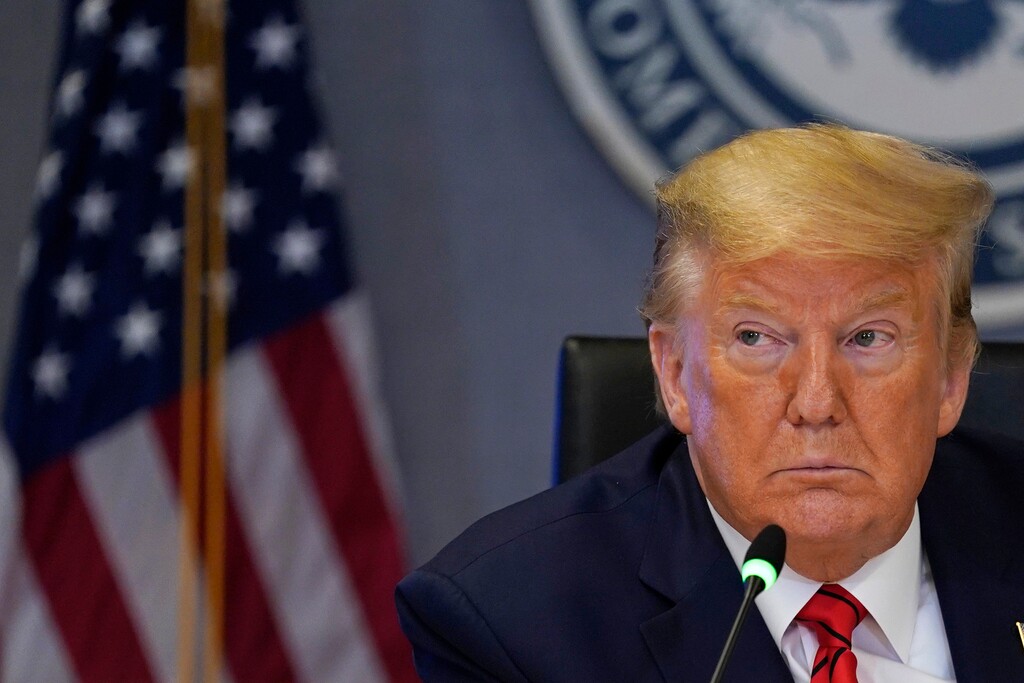 (Evan Vucci | AP)  President Donald Trump attends a teleconference with governors at the Federal Emergency Management Agency headquarters, Thursday, March 19, 2020, in Washington.