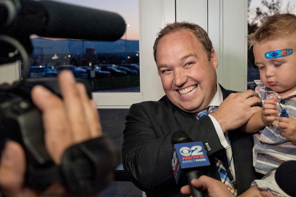 (Michael Mangum | Special to the Tribune) Adam Gardiner laughs with his son Mason as he speaks with the media following his election to Salt Lake county recorder during the county republican Central Committee Meeting at Jordan High School in Sandy, UT on Thursday, August 17, 2017.