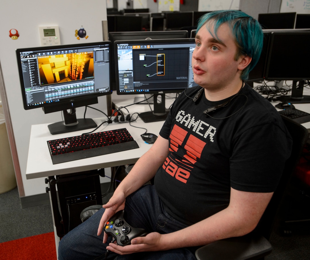 (Steve Griffin  |  The Salt Lake Tribune) Patrick Benson-Kingsland, a student in the University of Utah's Entertainment Arts & Engineering department (EAE), runs through the demonstration of his game during the department's  two-day event celebrating its 10th anniversary at the University of Utah in Salt Lake City Monday April 30, 2018. Tuesday is EAE Launch Day, where  students show off their game designs and finished games.