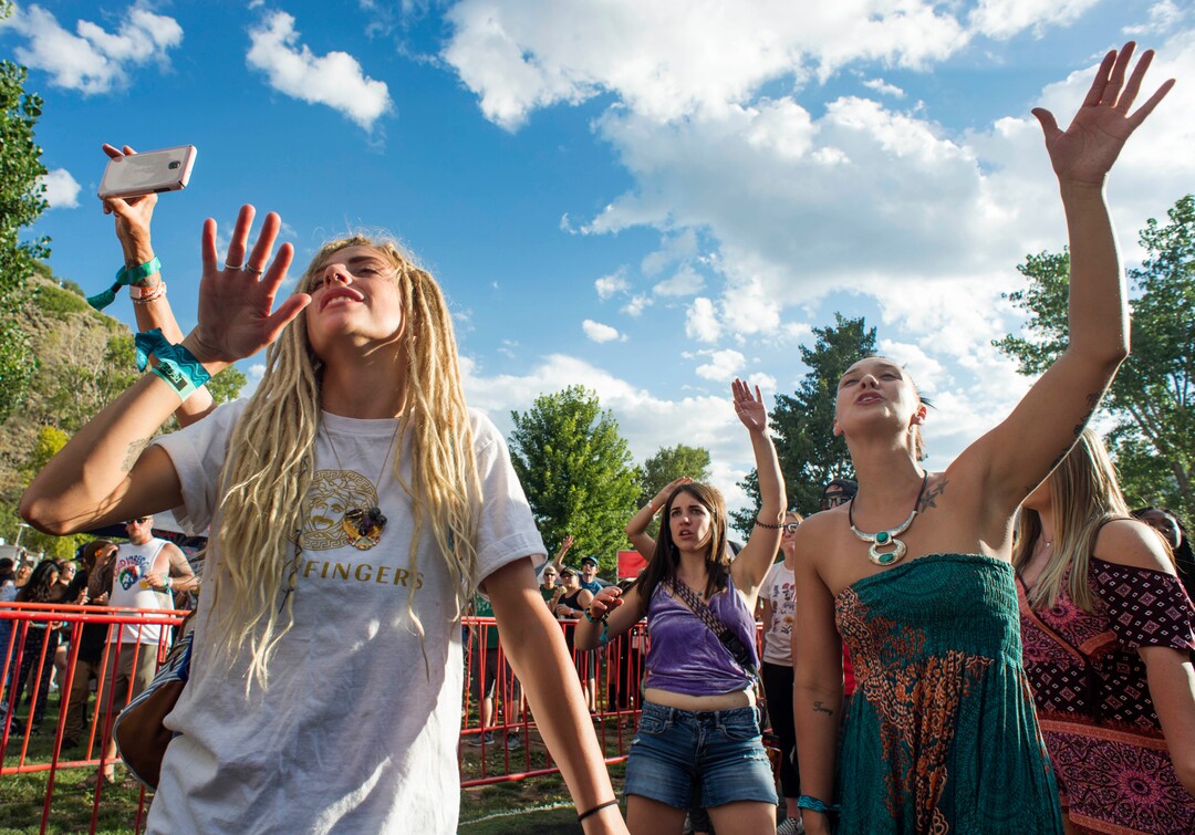 (Rick Egan  |  The Salt Lake Tribune)    Whitney Johnson and Cheyenne Thompson, dance to the music of Red Sage on the opening day of the 3-day Reggae Rise Up Festival at the Rivers Edge in Heber City, Friday, Aug. 24, 2018.