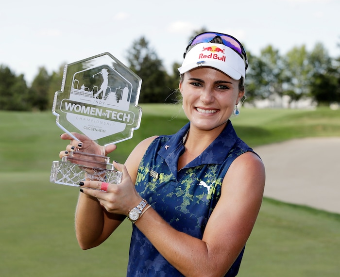 Lexi Thompson holds the trophy after winning the Indy Women in Tech Championship golf tournament, Saturday, Sept. 9, 2017, in Indianapolis. (AP Photo/Darron Cummings)