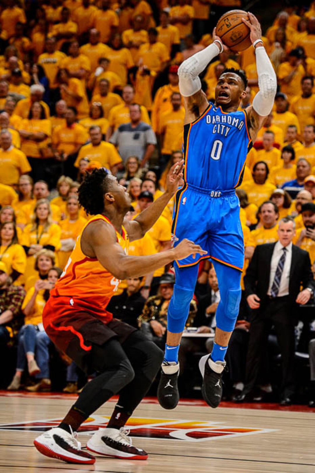 (Trent Nelson | The Salt Lake Tribune)  Utah Jazz host the Oklahoma City Thunder, Game 3, NBA playoff basketball in Salt Lake City, Saturday April 21, 2018. Oklahoma City Thunder guard Russell Westbrook (0) shoots over Utah Jazz guard Donovan Mitchell (45).