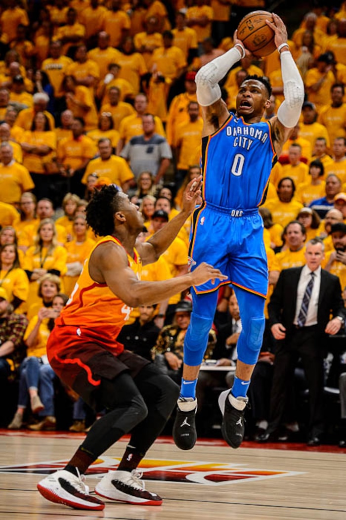 (Trent Nelson | The Salt Lake Tribune)  
Utah Jazz host the Oklahoma City Thunder, Game 3, NBA playoff basketball in Salt Lake City, Saturday April 21, 2018. Oklahoma City Thunder guard Russell Westbrook (0) shoots over Utah Jazz guard Donovan Mitchell (45).