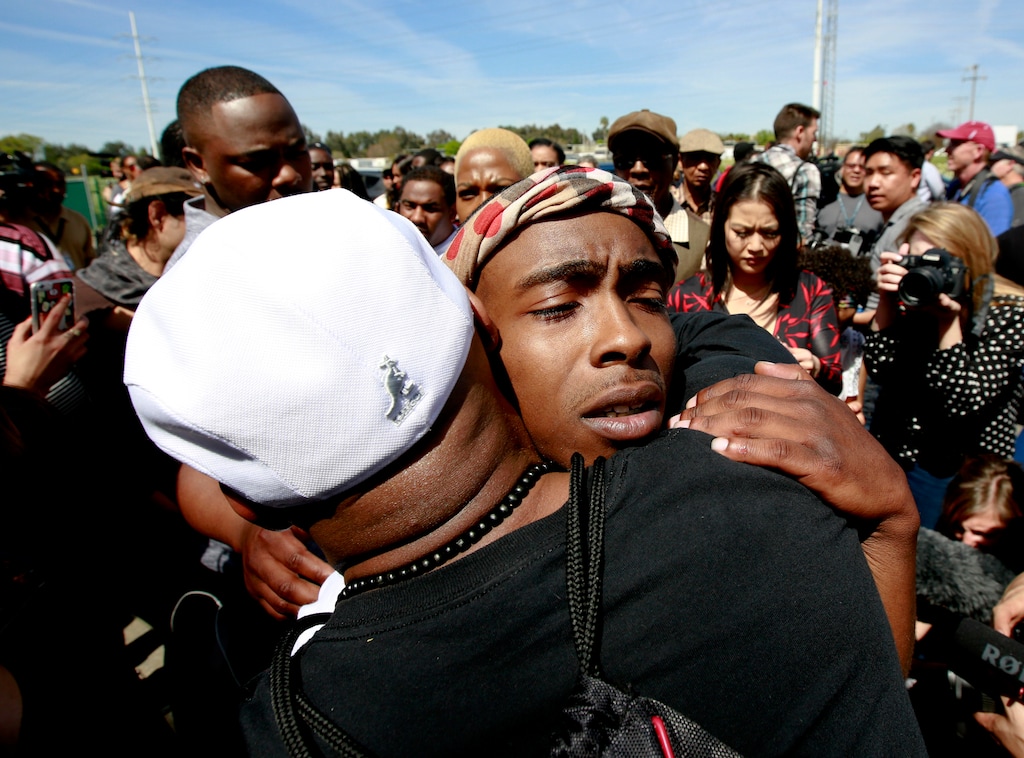 (Rich Pedroncelli | The Assocaited Press) Stevante Clark, the brother of police shooting victim, Stephon Clark, is hugged by a supporter after Stephon Clark's funeral Thursday, March 29, 2018, in Sacramento, Calif. Stephon Clark who was unarmed, was shot and killed by Sacramento Police Officers, Sunday, March 18, 2018.