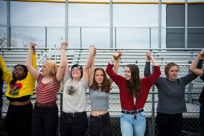 (Chris Detrick  |  The Salt Lake Tribune)  Students at Highland High School in Salt Lake City gather on the football field to participate in a nationwide demonstration for better gun safety laws Thursday, March 15, 2018. Students at more than 30 schools along the Wasatch Front, nearly all of them high schools, particiapted in the 17-minute walkout — one minute for each of the Florida students killed.