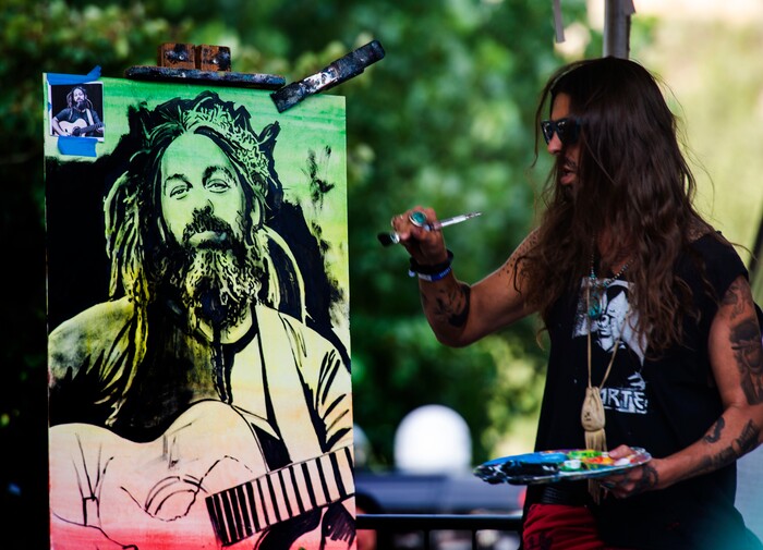 (Rick Egan  |  The Salt Lake Tribune)  Artist Jimmy Ovadia dances to the music as he paints a porrtait of Mike Love,  which her started and finished in during hi 45 minute set, on the side of the stage during the Regge Rise Up Music Festival at the Rivers Edge near Heber City, Friday, Aug. 23, 2019.