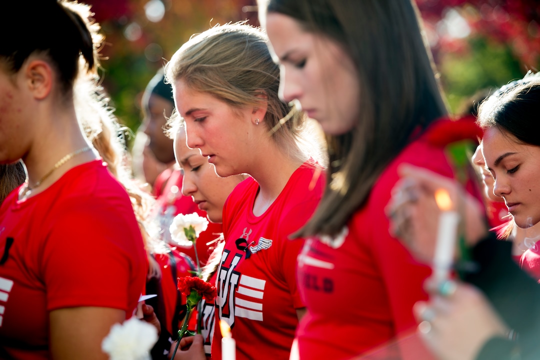 (Jeremy Harmon  |  The Salt Lake Tribune) Members of the University of Utah track team gather during a vigil for teammate Lauren McCluskey on Wed. Oct 24, 2018. McCluskey was killed on campus on Monday.