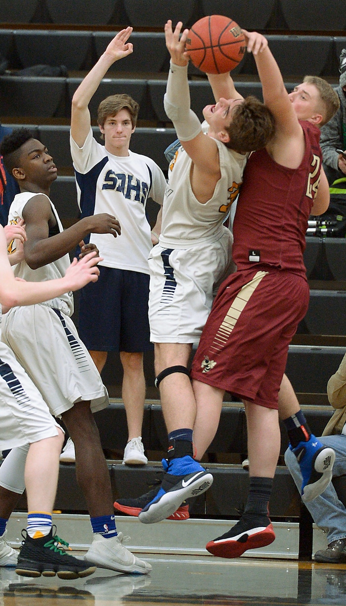 (Leah Hogsten  |  The Salt Lake Tribune) Summit's Tyler Kartchner gets the ball knocked away by Juab's Raiden Gould.  Juab High School boys' basketball team defeated Summit Academy 61-58 during their 3A State tournament game in Heber  Saturday, Feb. 17, 2018.