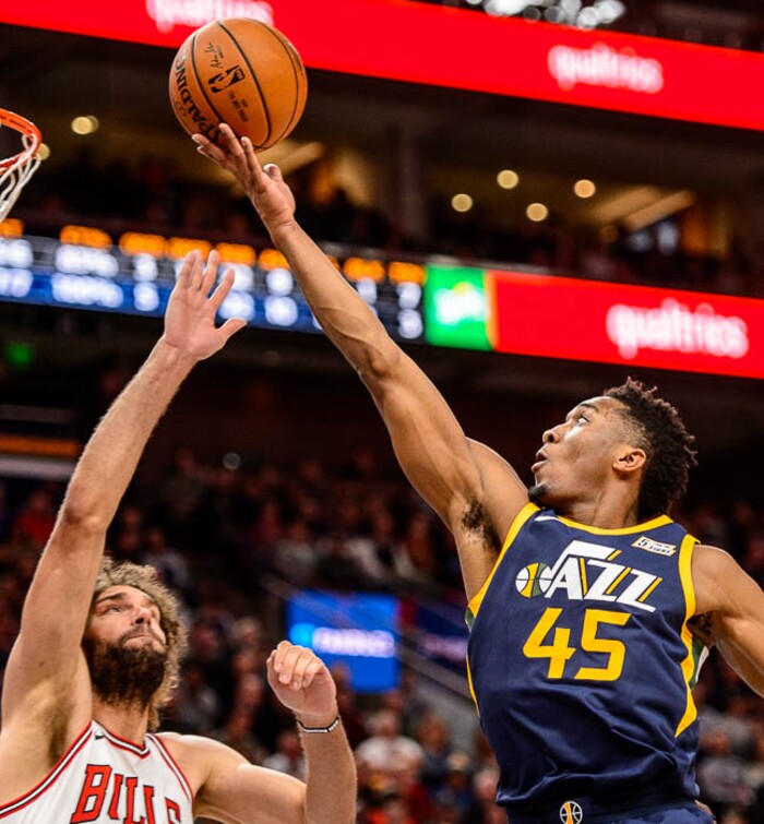 (Trent Nelson | The Salt Lake Tribune)  Utah Jazz guard Donovan Mitchell (45) shoots over Chicago Bulls center Robin Lopez (42) as the Utah Jazz host the Chicago Bulls, NBA basketball in Salt Lake City Wednesday November 22, 2017.