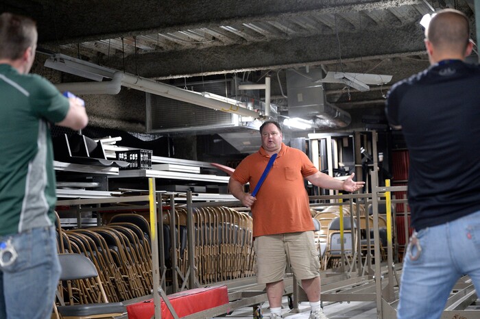 (Al Hartmann | The Salt Lake Tribune)
Dax Shane, a detective assigned to domestic violence with Salt Lake City Police center, play acts a violent and possibly suicidal man who thinks he is dying of AIDS in a scenario to train new police academy recruits. SLCPD recruits Jeremy Dimand, left, and Joel Morgan, right, had to draw guns because Shane is violent and pulled a large knife threatening to kill himself. A difficult situation from real life. The recruits had to de-escalate the situation, calm the person down while still protecting themselves. The Salt Lake City Police Department hosted a Crisis Intervention Team (CIT) Academy for police officers and police trainees Thursday, May 10, 2018. The academy provides training for officers and recruits to learn about and identify signs of citizens who are experiencing a mental health crisis.