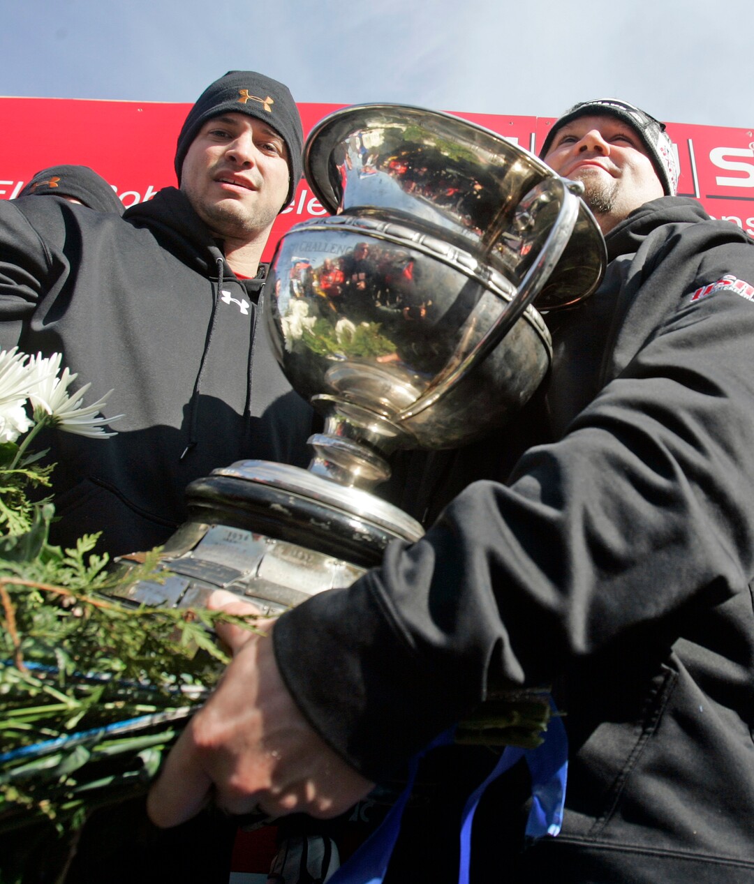 American driver Steven Holcomb, right, and teammate Steve Mesler celebrate their team's win in the men's Bobsled World Championships in Lake Placid, N.Y., Sunday, March 1, 2009.  (AP Photo/Mike Groll)