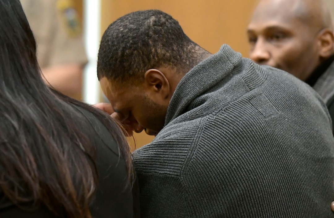 Torrey Green cries after a jury finds him guilty of eight charges including five counts of rape and a charge sexual battery in connection to reports from six women accusing him of sexual assault while he was a football player at Utah State University, Friday, Jan.18, 2019 in Brigham City, Utah. (Eli Lucero/Herald Journal via AP)