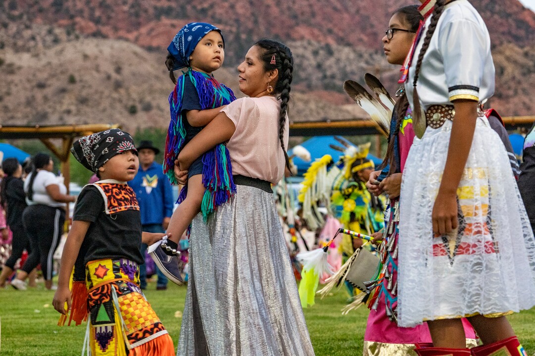 (Leah Hogsten | The Salt Lake Tribune Men, women and children from Native American tribes throughout the West show their regalia during the Grand Entry at the 41st Annual Paiute Indian Tribe of Utah Restoration Gathering, Aug. 13, 2021 in Cedar City, Utah.