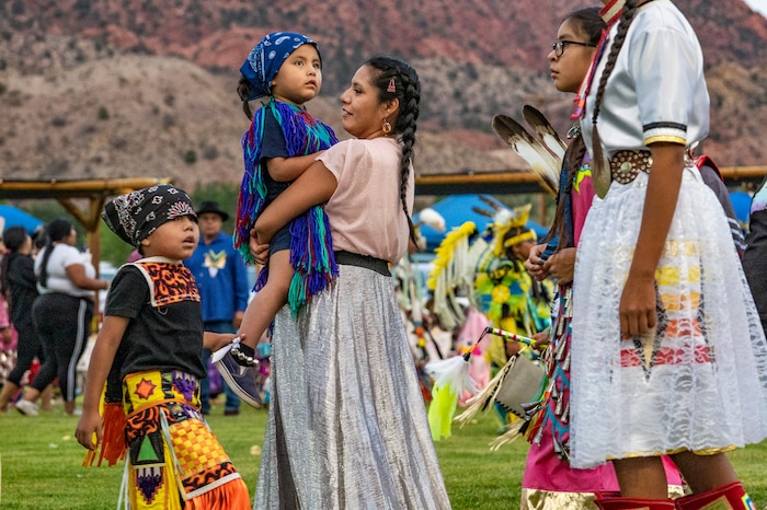(Leah Hogsten | The Salt Lake Tribune Men, women and children from Native American tribes throughout the West show their regalia during the Grand Entry at the 41st Annual Paiute Indian Tribe of Utah Restoration Gathering, Aug. 13, 2021 in Cedar City, Utah.