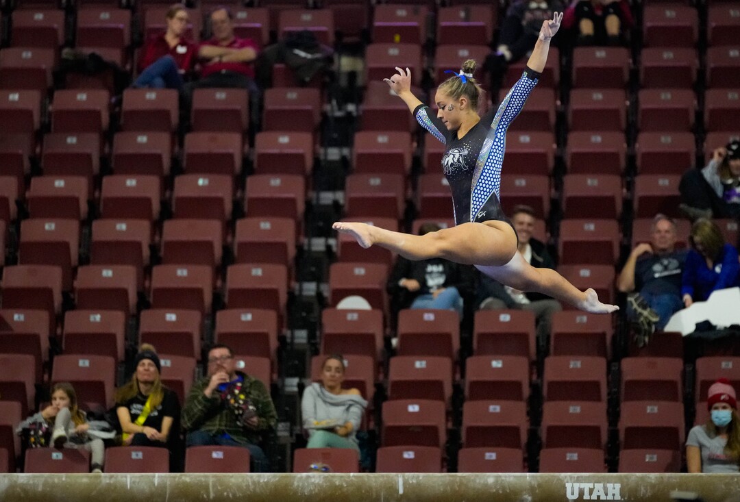 (Francisco Kjolseth | The Salt Lake Tribune) Utah State Kielyn McCright competes on the beam at the Best of Utah NCAA Gymnastics Meet at the Maverik Center in West Valley City on Friday, Jan. 7, 2022.