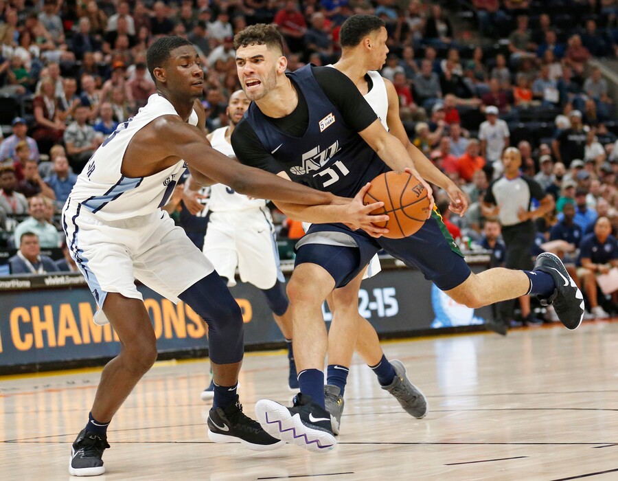 Memphis Grizzlies forward Jaren Jackson Jr., left, defends against Utah Jazz forward Georges Niang (31) during the second half of an NBA summer league basketball game Tuesday, July 3, 2018, in Salt Lake City. (AP Photo/Rick Bowmer)