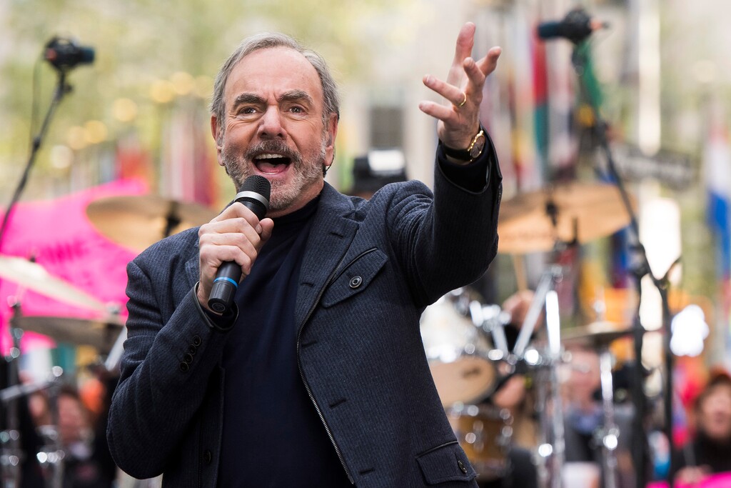 FILE - In this Oct. 20, 2014 file photo, Neil Diamond performs on NBC's "Today" show in New York. Diamond is retiring from touring after he says he was diagnosed with Parkinson’s disease. Days shy of his 77th birthday, the rock legend is canceling his tour dates in Australia and New Zealand for March. He was on his 50th anniversary tour. Diamond turns 77 on Wednesday and will get the lifetime achievement award at Sunday’s Grammy awards.  (Photo by Charles Sykes/Invision/AP)