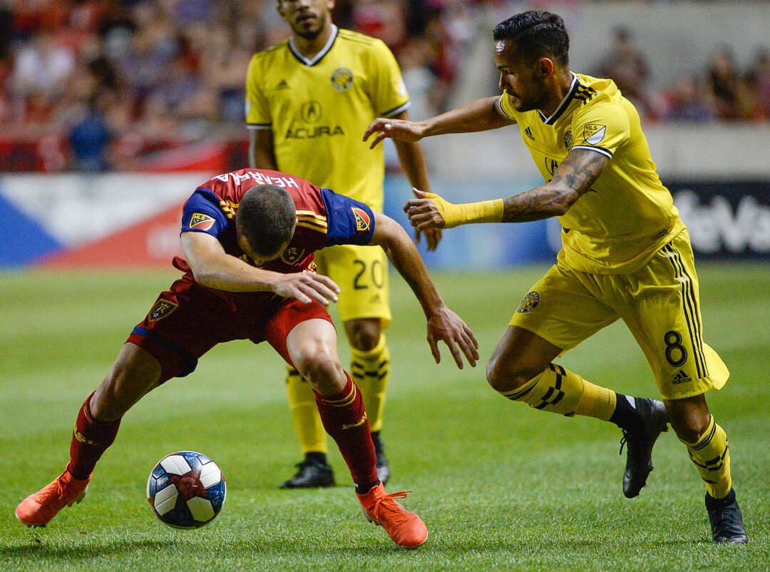 (Francisco Kjolseth  |  The Salt Lake Tribune)  Real Salt Lake defender Aaron Herrera (22) tries to regain control of the ball as Columbus Crew midfielder Artur (8) moves in as Real Salt Lake hosts Columbus Crew SC, in MLS Soccer at Rio Tinto Stadium in Sandy, Utah on Wed, July 3, 2019.