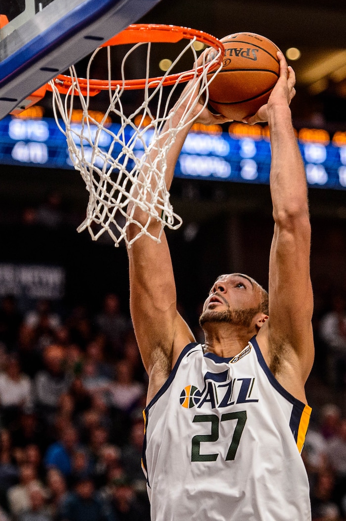 (Trent Nelson | The Salt Lake Tribune)  Utah Jazz center Rudy Gobert (27) dunks the ball as the Utah Jazz host the Denver Nuggets, NBA basketball in Salt Lake City, Wednesday October 18, 2017.