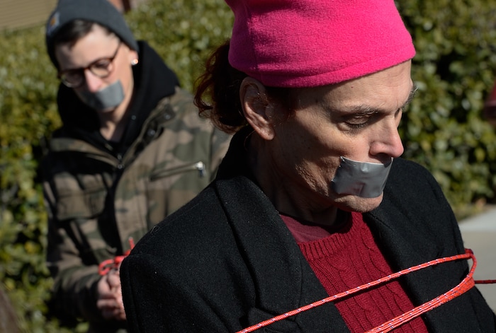 (Francisco Kjolseth | The Salt Lake Tribune) Lesley Ann Shaw, left, and Rachel Edward join other activists in Utah by being bound and duct taped outside of Salt City Tattoo on Friday, Dec. 22, 2017, to protest following an Instagram post made by the shopÕs official Instagram account. The post in question was of a gift provided during the shopÕs white elephant exchange, a gift one of the artists at the parlor called a Òrape kit,Ó containing leather gloves, black duct tape, a bottle of lubricant, rope, and a knife.