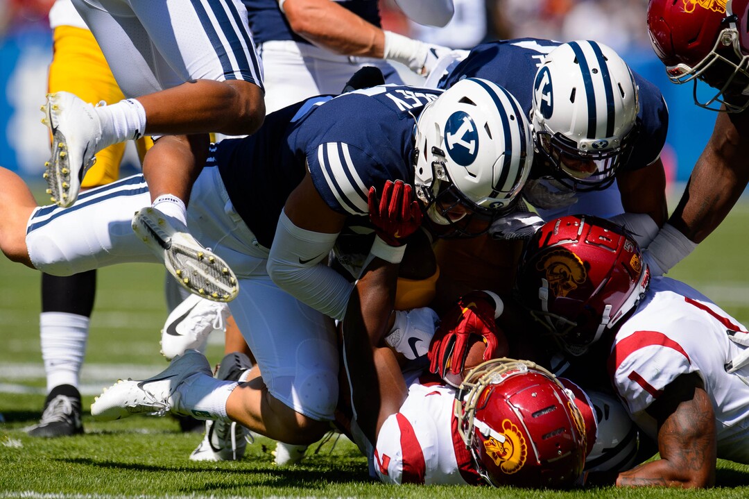 (Trent Nelson  |  The Salt Lake Tribune)  Brigham Young Cougars linebacker Max Tooley (31) brings down USC Trojans running back Stephen Carr (7) as BYU hosts USC, NCAA football in Provo on Saturday Sept. 14, 2019.