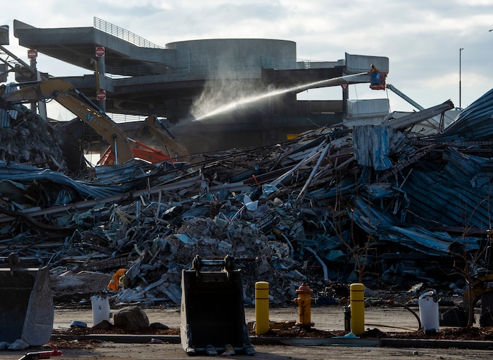 (Rick Egan | The Salt Lake Tribune)  Crews work on the demolition of the old parking garage at the Salt Lake International Airport, to make way for the expansion of the new terminals, on  Tuesday, Nov. 24, 2020.
