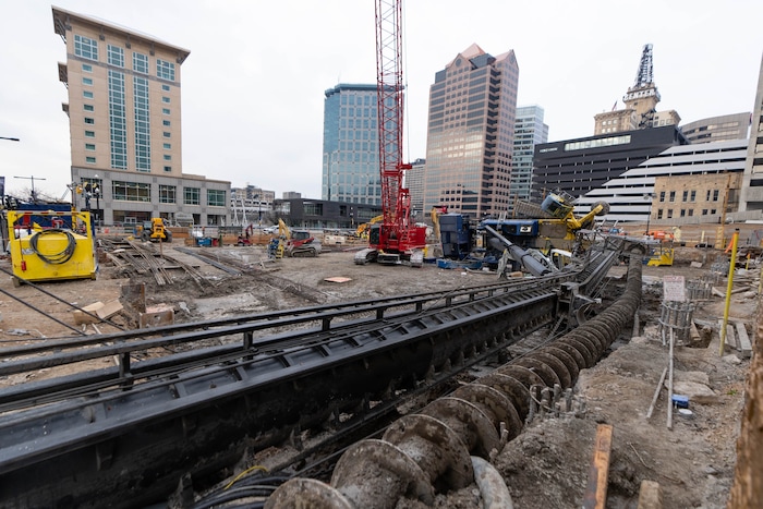 (Francisco Kjolseth | The Salt Lake Tribune) A collapsed drill rig is seen on Wednesday, March 16, 2022, at the intersection of State Street and 200 South. The rig toppled over Tuesday night at the site of the new Astra Tower, crushing two unoccupied parked cars and sending the crane operator to the hospital in serious condition.