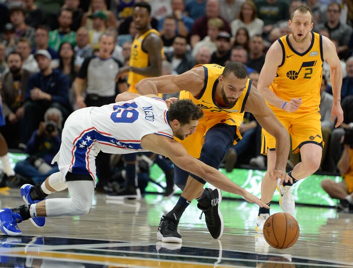 (Francisco Kjolseth  |  The Salt Lake Tribune)  Former Jazz player Philadelphia 76ers guard Raul Neto (19) battles Utah Jazz center Rudy Gobert (27) for a ball as the Utah Jazz host the Philadelphia 76ers in their NBA basketball game at Vivint Smart Home Arena in Salt Lake City on Wed. Nov. 6, 2019.