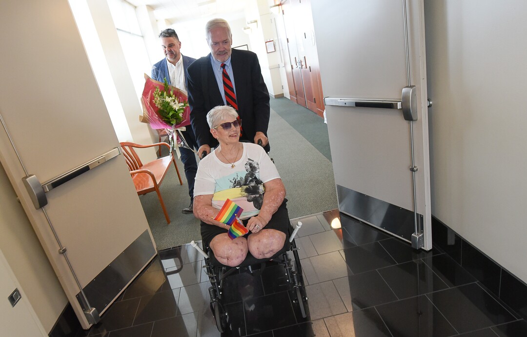 (Francisco Kjolseth  |  The Salt Lake Tribune)  Bonnie Foerster, 74, of South Salt Lake finally gets her wish of marrying her common-law partner of 50 years, Beverly Grossaint, even though she died on May 27. Foerster, pushed by her attorney Roger Hoole is joined by Utah Pride Center Executive Director Rob Moolman as she beams with excitement before her court appearance where a judge provided the legal recognition and allowed her to be legally married on Tuesday, Aug. 21, 2108, at the Matheson Courthouse in Salt Lake City.