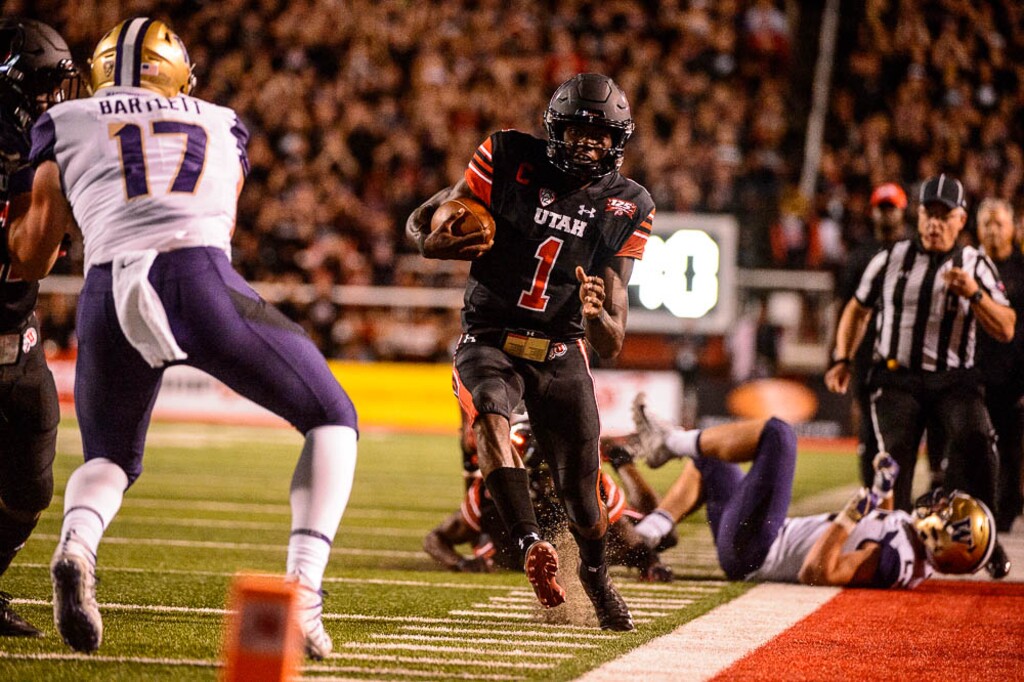 (Trent Nelson | The Salt Lake Tribune)  Utah Utes quarterback Tyler Huntley (1) runs the ball as the University of Utah hosts Washington at Rice-Eccles Stadium in Salt Lake City, Saturday Sept. 15, 2018.