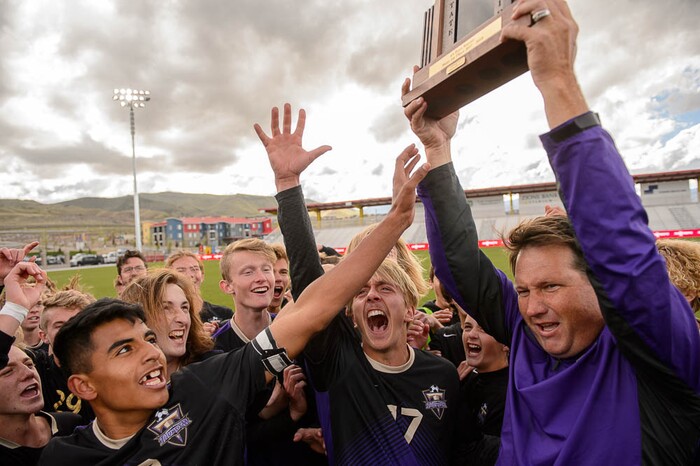 (Trent Nelson | The Salt Lake Tribune)  Desert Hills players celebrate their win over Park City High School in the 4A state championship game, Saturday May 12, 2018.