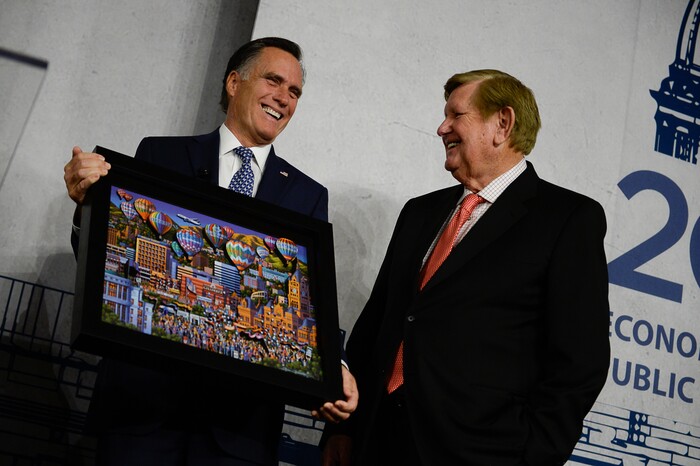 (Francisco Kjolseth  |  The Salt Lake Tribune)  Mitt Romney is joined by Kem C. Gardner as he is given a gift following his speaking engagement at the Utah Economic Outlook & Policy Summit 2018, hosted by the Salt Lake Chamber at the Salt Lake City Marriott Downtown at City Creek on Tuesday, Jan. 16, 2018.