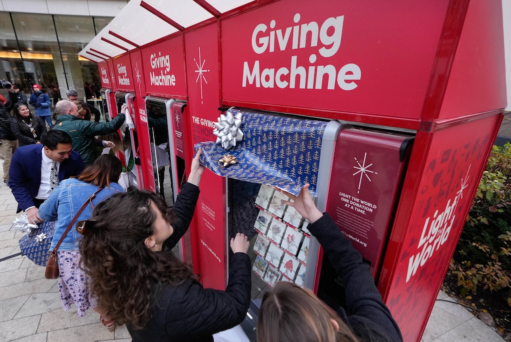 (Francisco Kjolseth | The Salt Lake Tribune) Charitable options are revealed as part of the annual Light The World initiative, with The Church of Jesus Christ of Latter-day Saints announcing the return of the charity Giving Machines in the plaza at City Creek Center in Salt Lake City on Wednesday, Nov. 24, 2021.
