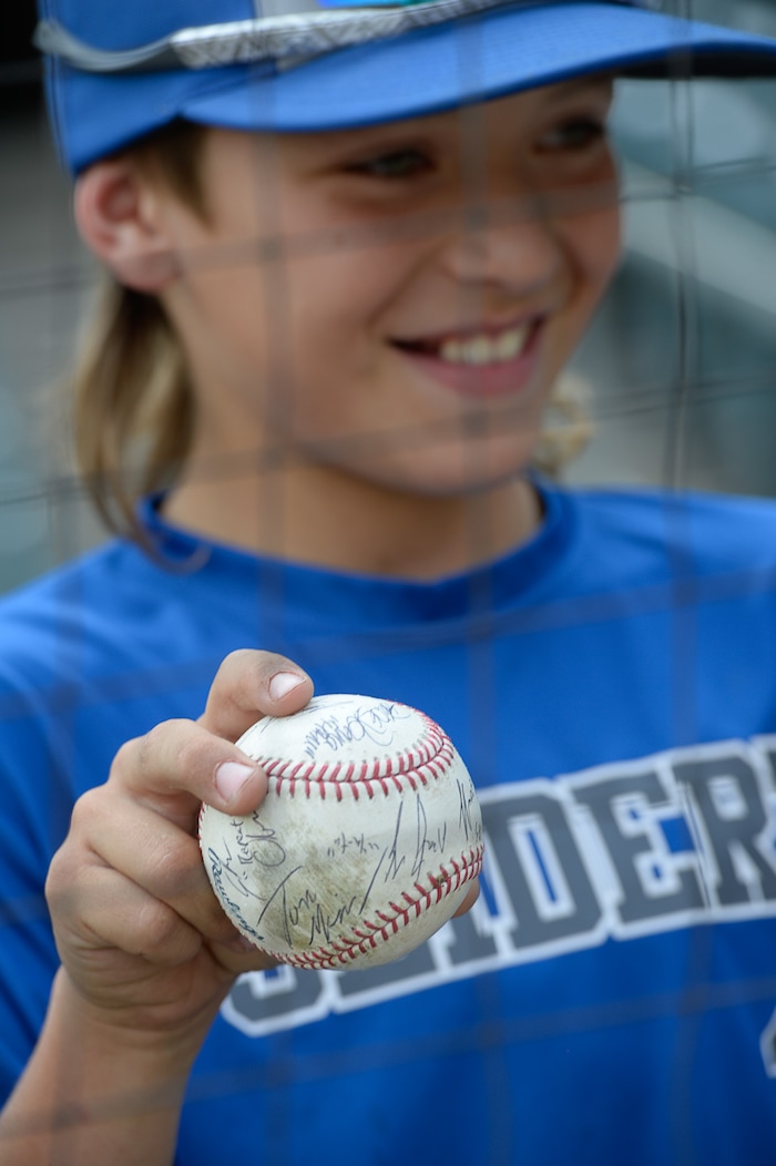 (Francisco Kjolseth  |  The Salt Lake Tribune)  Young fan of the Utah-filmed "The Sandlot," Rydge Butler, 11, is all smiles as he gets a signed baseball by members of the cast. "I've watched the movie like a hundred times," exclaimed Butler as the the Salt Lake Bees celebrate the 25th anniversary of the film with members of the original cast at the Smith's Ballpark on Friday, Aug. 10, 2018.