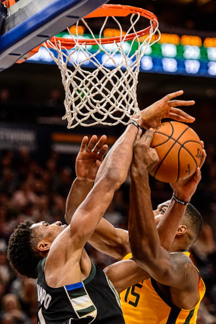 (Trent Nelson | The Salt Lake Tribune)  Utah Jazz forward Derrick Favors (15) blocks a shot by Milwaukee Bucks forward Giannis Antetokounmpo (34) as the Utah Jazz host the Milwaukee Bucks, NBA basketball in Salt Lake City Saturday November 25, 2017.