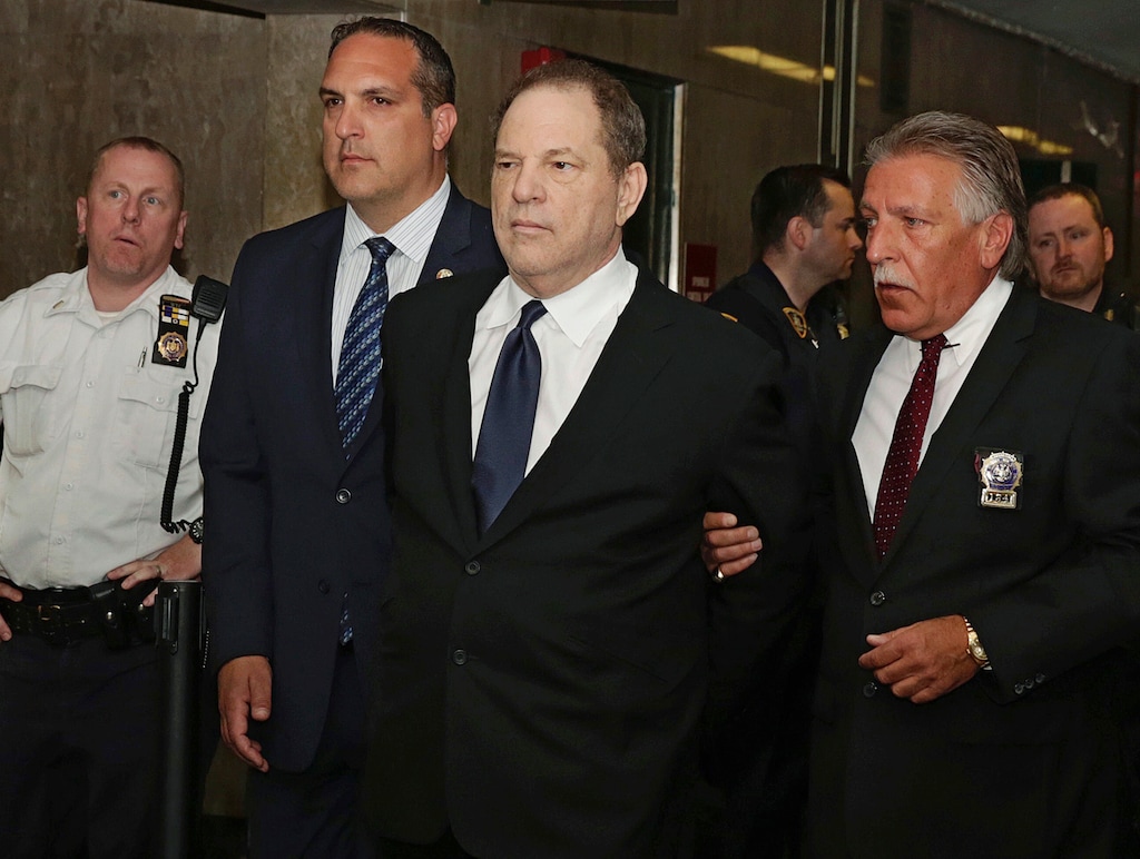 FILE - In this July 9, 2018 file photo, Harvey Weinstein is escorted in handcuffs to a courtroom in New York. Weinstein, who was previously indicted on charges involving two women, was due in court for arraignment on charges alleging he committed a sex crime against a third woman. For many, the Weinstein case laid bare the movie industry’s systemic gender inequalities. Twelve months later, the dust isn’t anywhere close to settling. (AP Photo/Richard Drew, File)