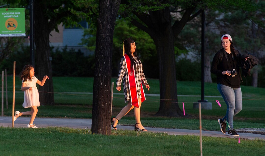 (Rick Egan  |  The Salt Lake Tribune)    Meilah Toro, 5 follows her mother Victoria Gamarra and photographer, Britlee Stokes  as they take graduation photos at Presidents Circle at the University of Utah, Thursday April 30, 2020