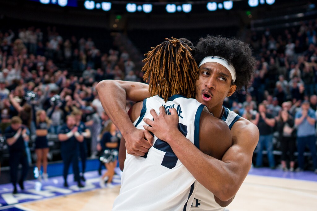 (Trent Nelson  |  The Salt Lake Tribune) Utah State Aggies guard Josh Uduje (14) and Utah State Aggies guard Ian Martinez (4) celebrate the win as Utah State faces San Francisco in Salt Lake City on Saturday, Dec. 16, 2023.