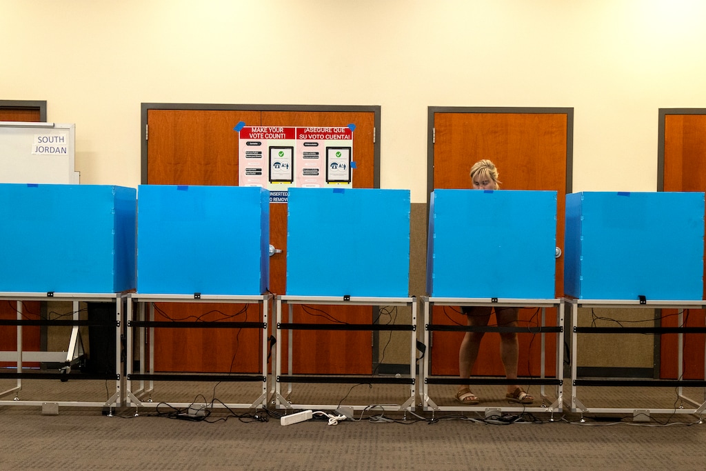 (Rick Egan | The Salt Lake Tribune) A voter casts her ballot at the South Jordan Library on Tuesday, Nov. 4, 2025.

