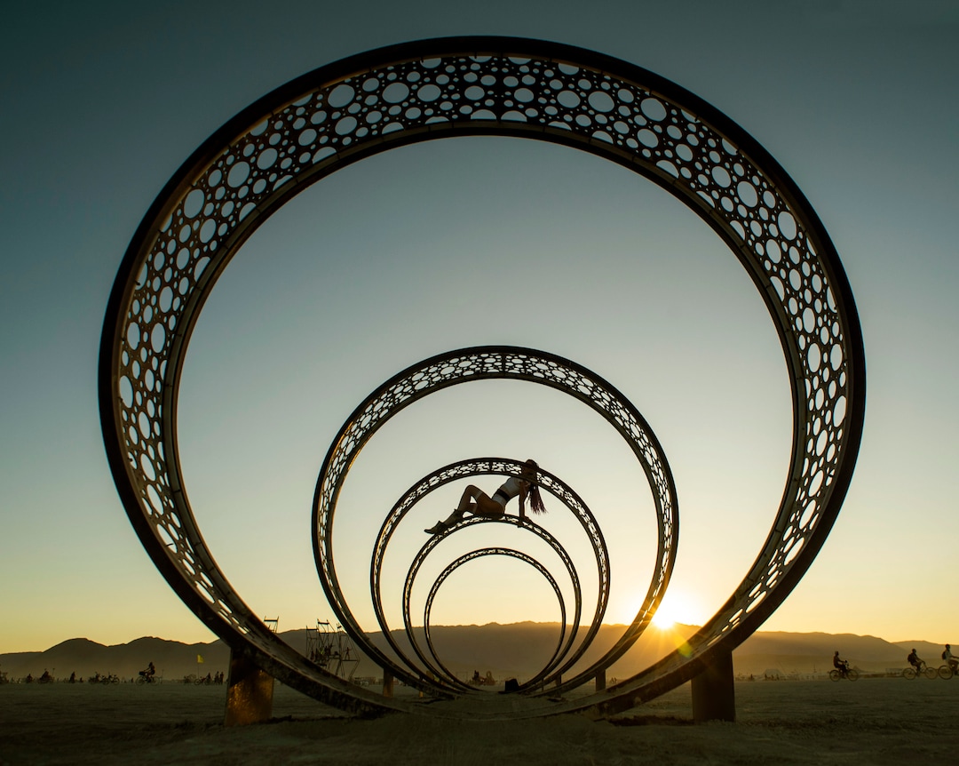 (Rick Egan  |  The Salt Lake Tribune)   Cynthia Fowler, from Hawaii poses on top of  of an art installation called "Centered" by Darrell E. Anstedat, at Burning Man, Friday, Aug. 31, 2019.