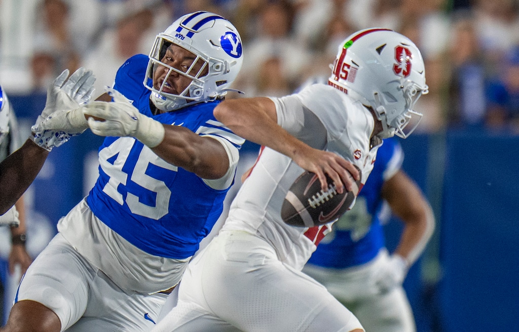 (Rick Egan | The Salt Lake Tribune) Brigham Young Cougars defensive end Viliami Po'uha (45) puts [pressure on Stanford Cardinal quarterback Ben Gulbranson (15), in football action between the Brigham Young Cougars and the Stanford Cardinal, at Lavell Edwards Stadium on Saturday Sept. 6, 2025.