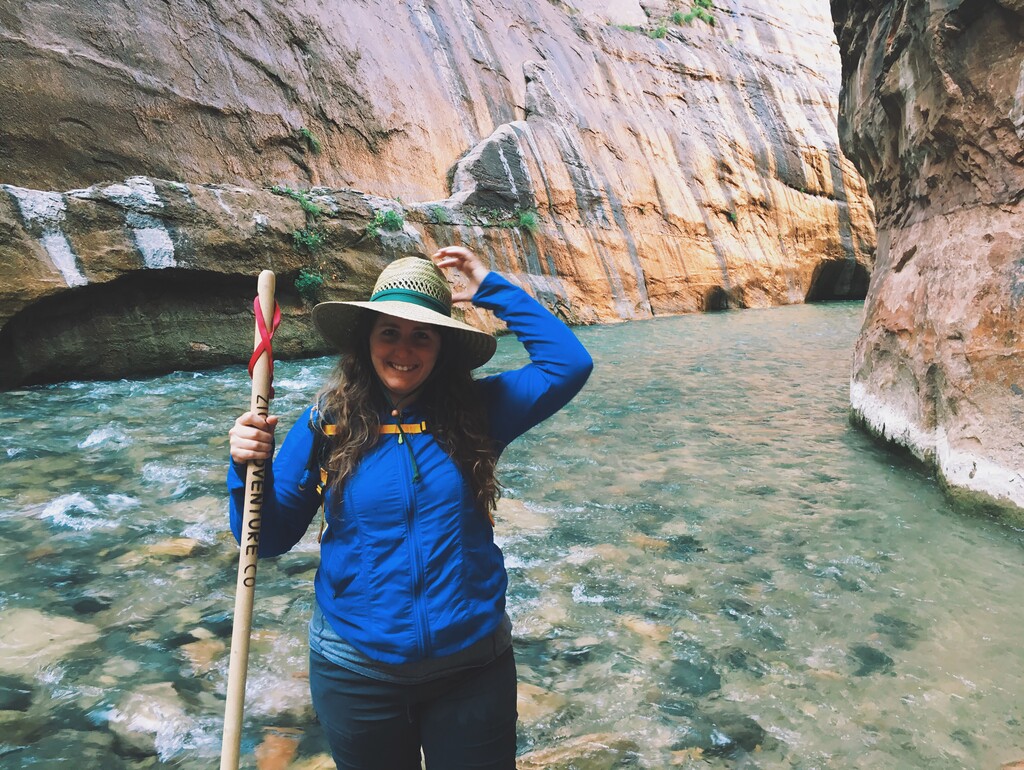 (Courtesy of Dave Kyu via The New York Times) Ilyssa Kyu, the founder of Amble, hikes The Narrows in Zion National Park in Utah. Amble, a crowdfunded startup, organizes monthlong retreats that pair creative professionals with budget-strapped national park conservancies.