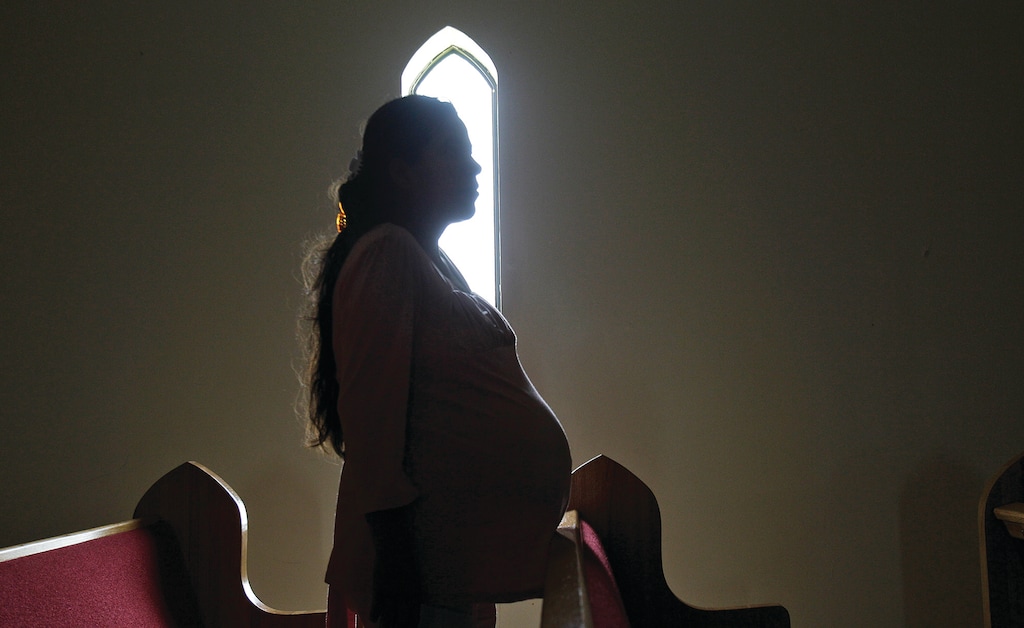 A mother of six from Monterrey, Mexico, who crossed into the U.S. illegally in the late 1990s, poses for a photo, Friday, Aug. 27, 2010, in San Juan, Texas. All of her children were born in the U.S.  (AP Photo/Eric Gay)