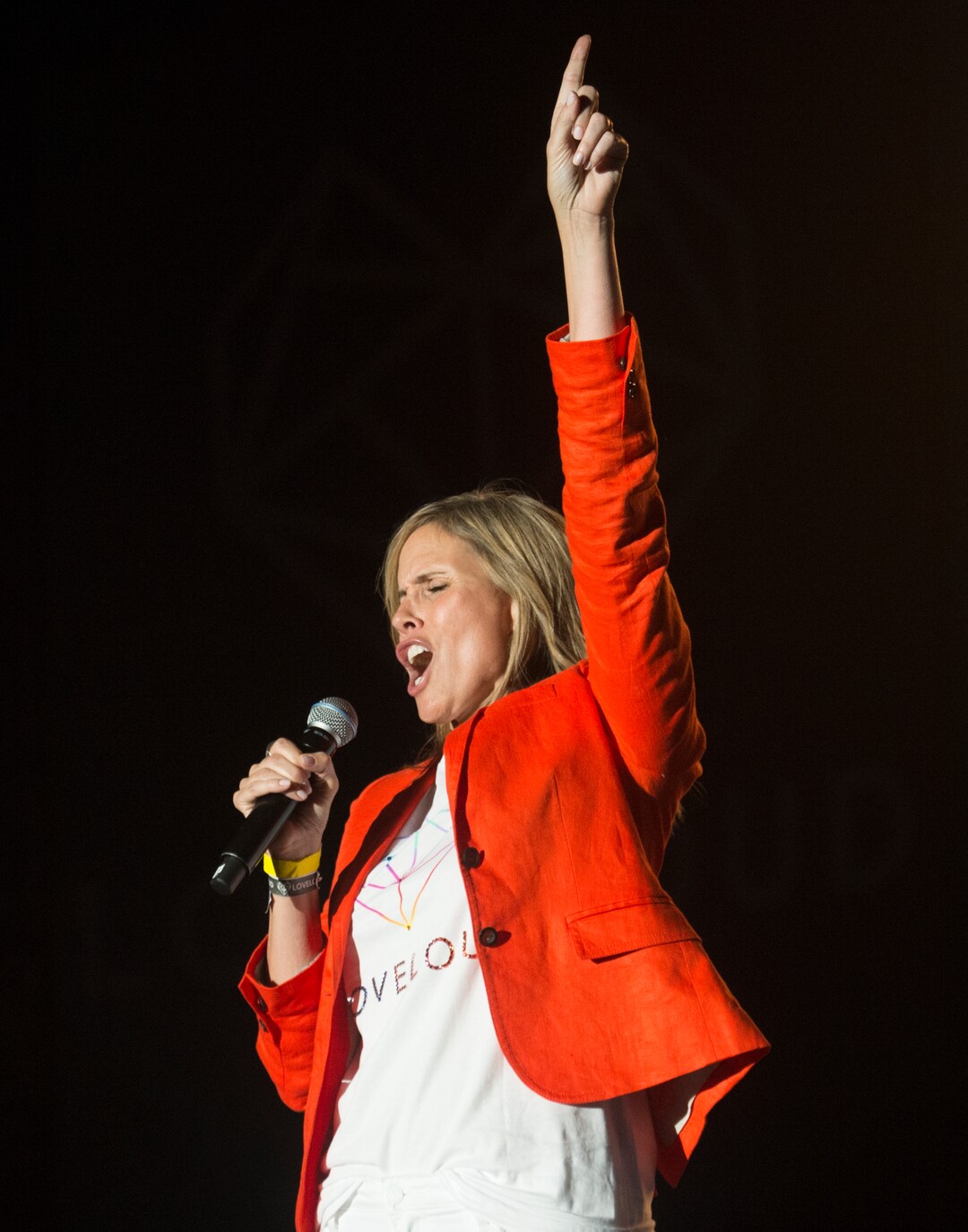 (Rick Egan  |  The Salt Lake Tribune)     Barb Young introduces Tim Cook, at the Loveloud Festival at Rice-Eccles Stadium, Saturday, July 28, 2018.
