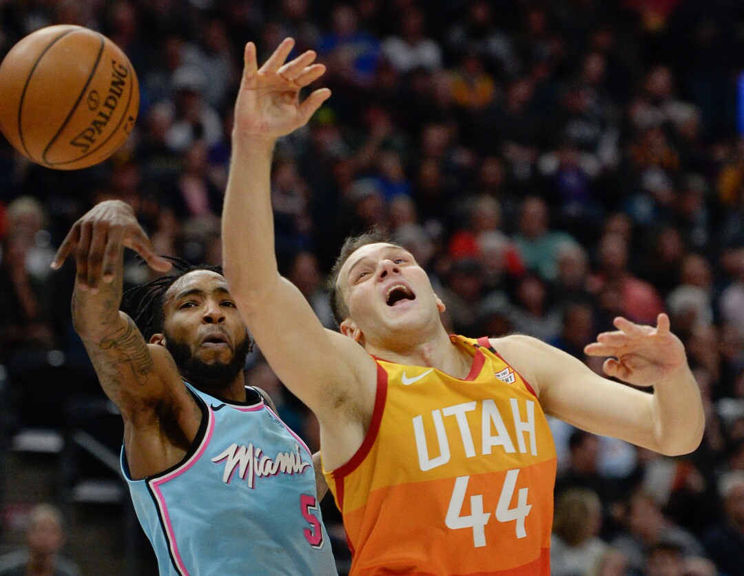 (Francisco Kjolseth  |  The Salt Lake Tribune) Miami Heat forward Derrick Jones Jr. (5) knocks the ball from Utah Jazz forward Bojan Bogdanovic (44) as the Utah Jazz host the Miami Heat in their NBA basketball game at Vivint Smart Home Arena in Salt Lake City on Wednesday, Feb. 12, 2020.