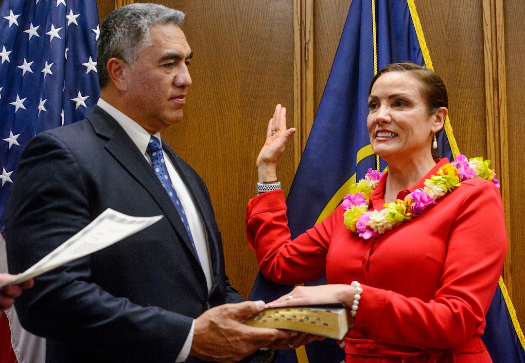 (Steve Griffin  |  The Salt Lake Tribune) As her husband Steve Kaufusi holds the Bible Michelle Kaufusi takes the Oath of Office as she becomes the first female mayor in Provo city's history. The small private ceremony was held in the Mayor's Office in Provo Tuesday January 2, 2018.  A public Inauguration Ceremony for Mayor Kaufusi will be held at the Provo Library on January 18, 2018.