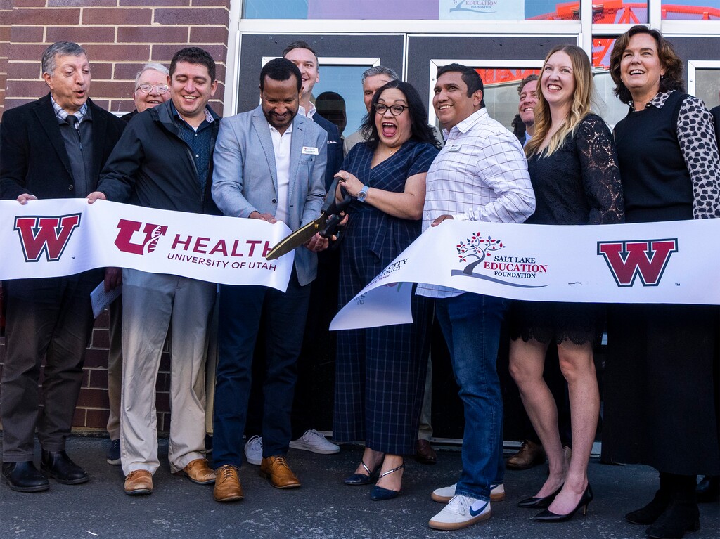 (Rick Egan | The Salt Lake Tribune)  Senate Minority Leader Luz Escamilla, D-Salt Lake City, cuts the ribbon for the new health clinic at West High School, on Wednesday, March 20, 2024.