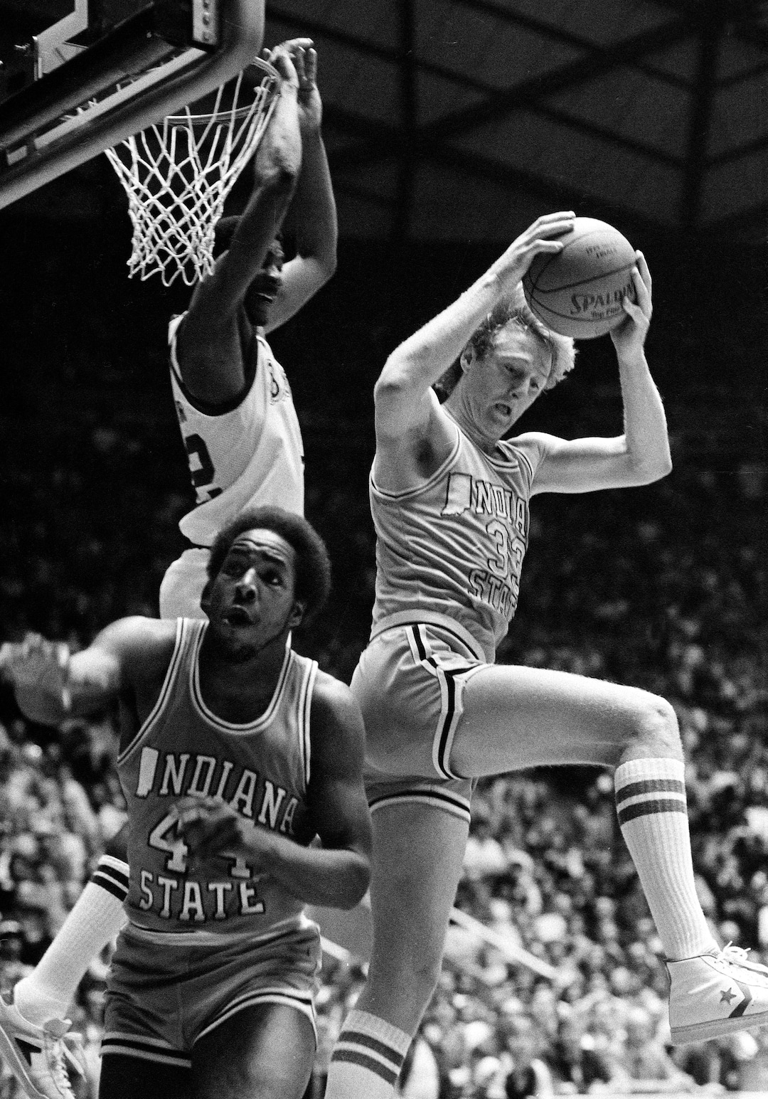 (AP Photo) Indiana State's Larry Bird pulls down a rebound as Michigan State's Greg Kelser, behind Bird, and Leroy Stale (44), jockey for position during the NCAA Championship game, at Salt Lake City, March 27, 1979. 